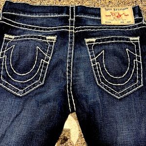 33 relaxed skinny True Religion jeans. Dark wash with light blue stitching.